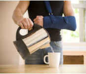 working in the kitchen with a sling